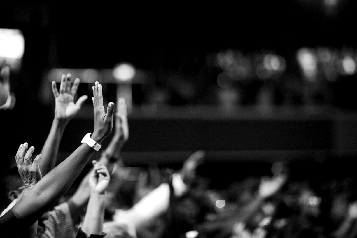 Grayscale Photography Of Hands Waving